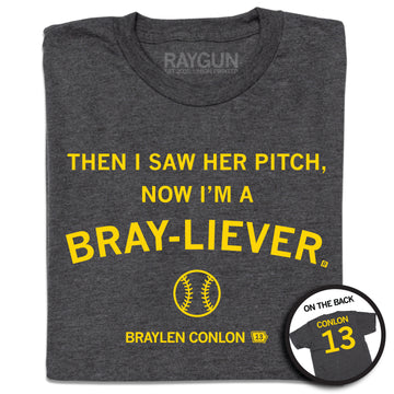 Charcoal T-shirt with the yellow text THEN I SAW HER PITCH, NOW IM A BRAY-LIEVER, a baseball icon, and the name BRAYLEN CONLON 13, with an inset showing the back of the shirt reading CONLON 13.