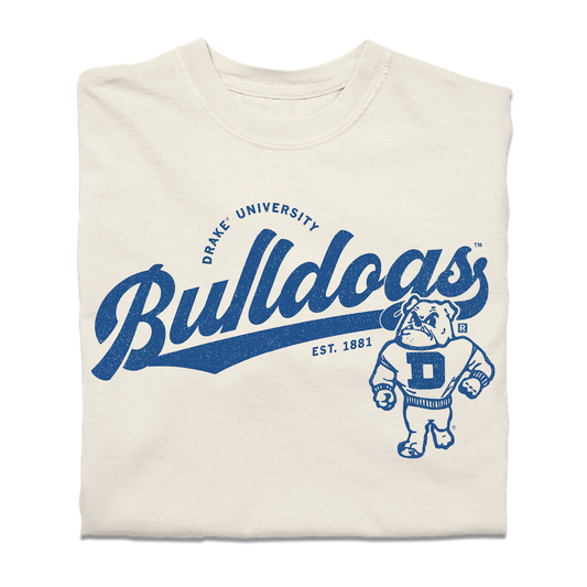 Heavyweight ivory t-shirt featuring Drake University Bulldogs text and a blue bulldog mascot illustration.