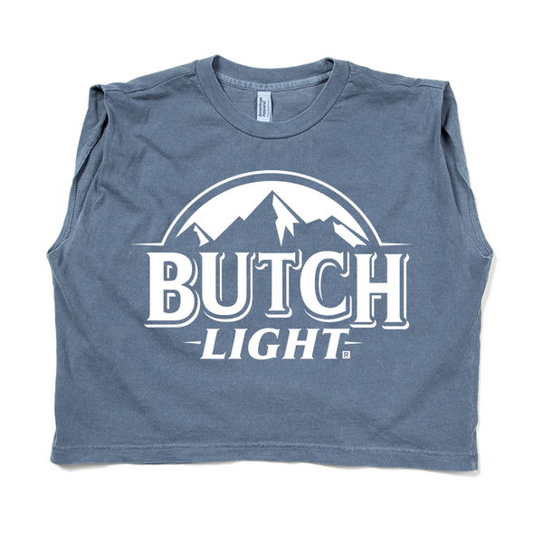 A steel blue sleeveless muscle crop top with white print of a mountain range with text below it that reads 