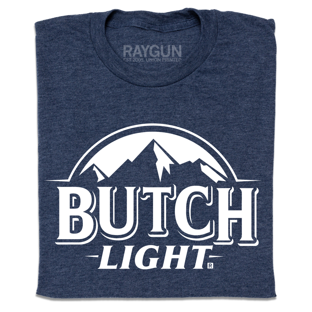 A heather navy t-shirt with white print that reads "Butch Light." beneath an illustration of a mountain range.
