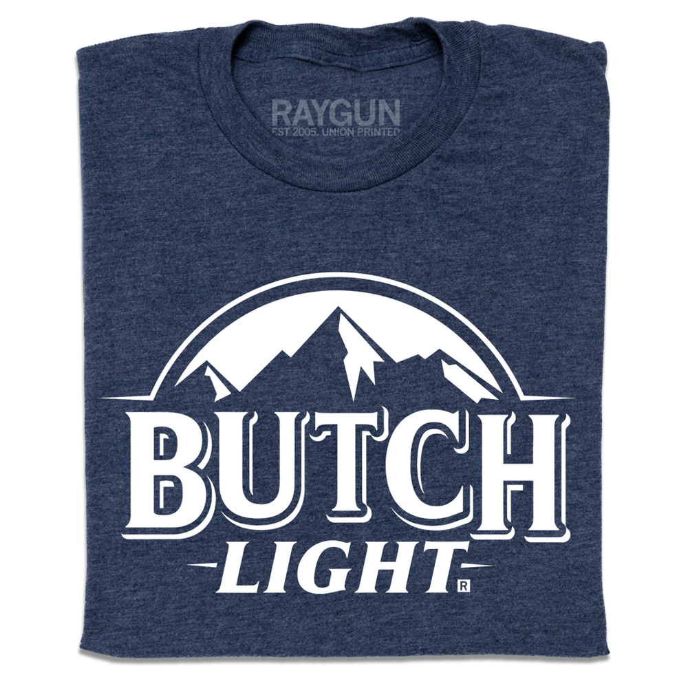 A heather navy t-shirt with white print that reads "Butch Light." beneath an illustration of a mountain range.