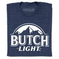 A heather navy t-shirt with white print that reads "Butch Light." beneath an illustration of a mountain range.