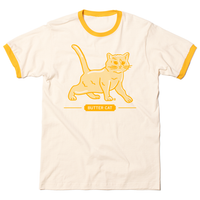Short sleeve vintage white ringer shirt with yellow sleeve and collar accents. Gold ink printed with a gradient depicts a cat made of butter, spoofing the butter cow. Text below says "BUTTER CAT."