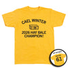 Short-sleeve heather mellow yellow t-shirt with a black print image of a hay bale with an outline of Iowa on it and number 61 in the center. Curved text at the top says, "CAEL WINTER" and straight text below reads "2026 HAY BALE CHAMPION." A small circle image in the bottom right highlights the back print. The back of the shirt is laid out like a jersey with "WINTER" printed above "61"