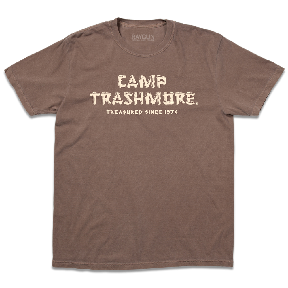 Comfort Colors brown heavyweight t-shirt with off-white ink that says, "Camp Trashmore. Treasured since 1974." printed in a font reminiscent of old summer camps.
