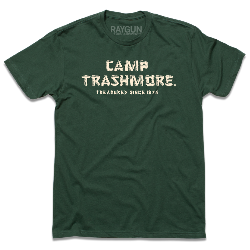 Short sleeve forest green t-shirt with off-white ink that says, "Camp Trashmore. Treasured since 1974." printed in a font reminiscent of old summer camps.