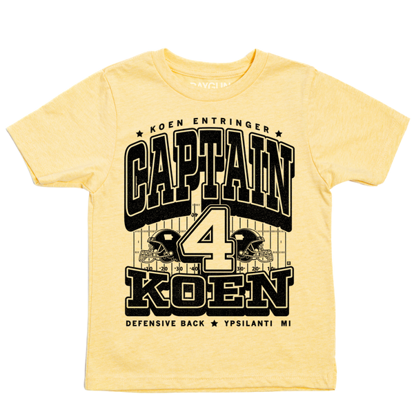 Pastel yellow youht t-shirt with black ink that reads 