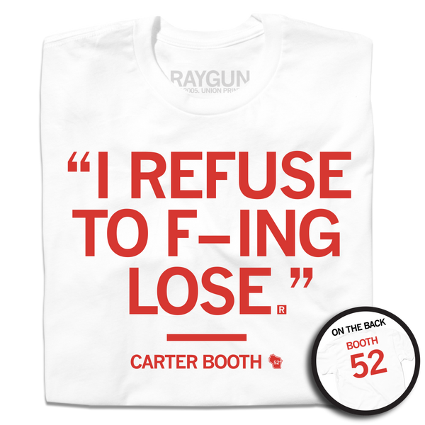 A folded white t-shirt with red ink text in quotes that reads 