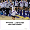 A volleyball player in a white UNI jersey serves a ball in front of her teammates on this heather grey t-shirt, with the text APPROVED & LICENSED BY CASSIDY HARTMAN! below.