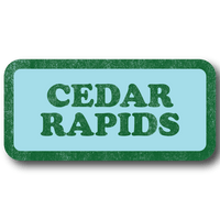 A rectangular light blue sticker with a faded green border and faded green text that says, "CEDAR RAPIDS" in a vintage look.