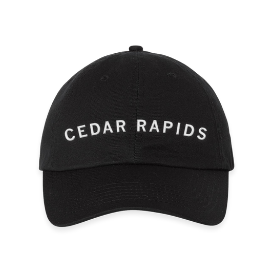 Black RAYGUN baseball cap with CEDAR RAPIDS embroidered in white text on the front.