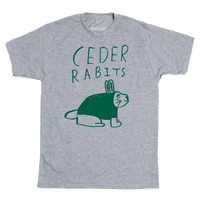 Short-sleeve heather grey t-shirt with kelly green ink that says, "Ceder Rabits" above an illustration of a rabbit. This shirt was designed by a kid taking part in a contest at our Cedar Rapids store.