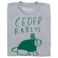 A folded heather grey t-shirt with kelly green ink that says, "Ceder Rabits" above an illustration of a rabbit. This shirt was designed by a kid taking part in a contest at our Cedar Rapids store.