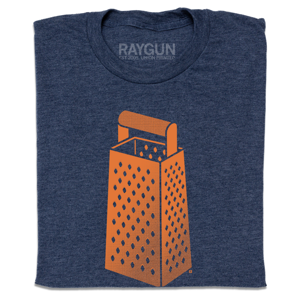 A folded heather navy t-shirt with an orange print of a cheese grater.