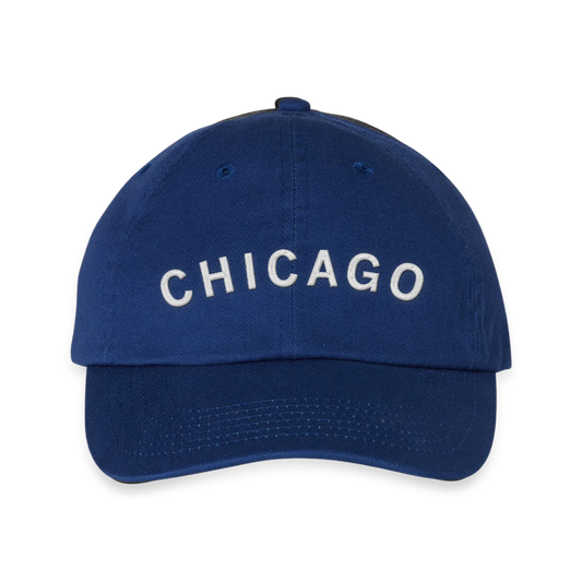 A blue RAYGUN baseball cap with the word CHICAGO embroidered in white lettering on the front.