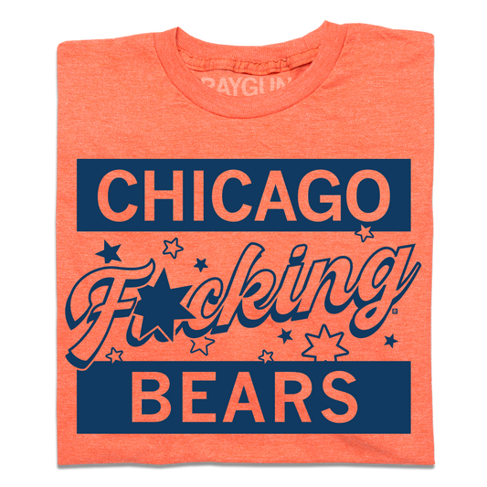 A folded heather orange shirt with navy ink that says, Chicago F*cking Bears" with stars around the center.