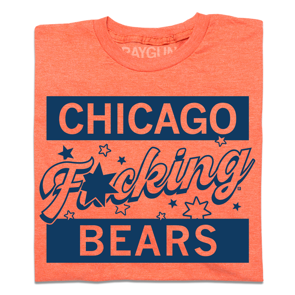 A folded heather orange shirt with navy ink that says, Chicago F*cking Bears" with stars around the center.