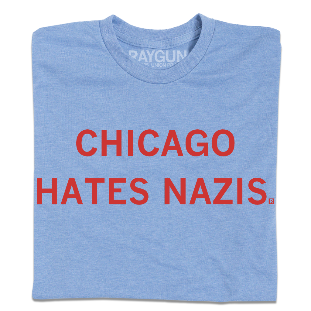 Light blue RAYGUN t-shirt featuring the red text CHICAGO HATES NAZIS printed on the chest.