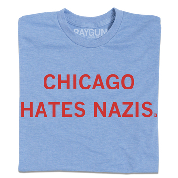 Light blue RAYGUN t-shirt featuring the red text CHICAGO HATES NAZIS printed on the chest.