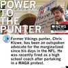Chris Kluwe smiles while wearing a Trevor Project shirt and holding a sign that says Former NFL Player during a protest.