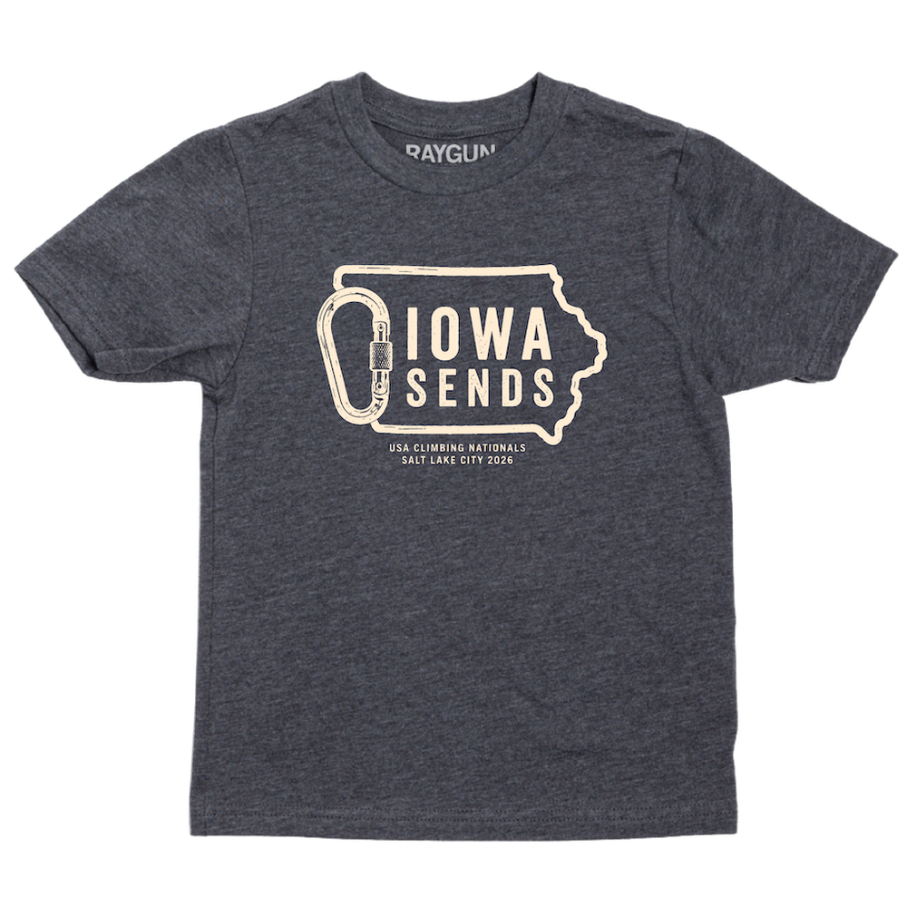 A youth sized charcoal t-shirt with off white ink showing an outline of Iowa with it's western border being a carabiner. Large text inside the state outline says, "Iowa sends" and smaller text below reads "US Climbing Nationals. Salt Lake City 2026"