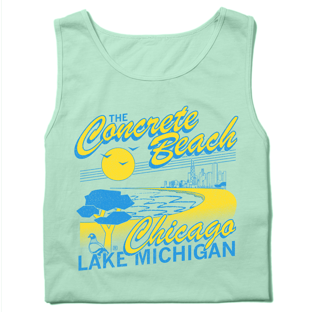 Folded pastel green tank top with bright yellow and blue print that reads "The Concrete Beach. Chicago, Lake Michigan" with an illustration of a beachfront Chicago skyline and a pigeon in the corner.