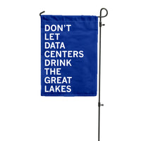 A royal blue garden flag with centered white text that says, "Don't Let Data Centers Drink The Great Lakes."