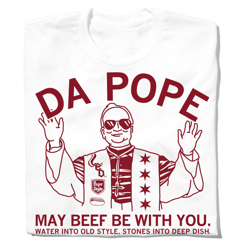White union-made t-shirt featuring a red line-art illustration of a person wearing sunglasses and a star-covered vest, with the text DA POPE, MAY BEEF BE WITH YOU, and WATER INTO OLD STYLE, STONES INTO DEEP DISH.