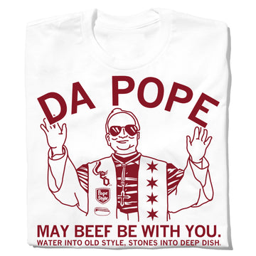 White union-made t-shirt featuring a red line-art illustration of a person wearing sunglasses and a star-covered vest, with the text DA POPE, MAY BEEF BE WITH YOU, and WATER INTO OLD STYLE, STONES INTO DEEP DISH.