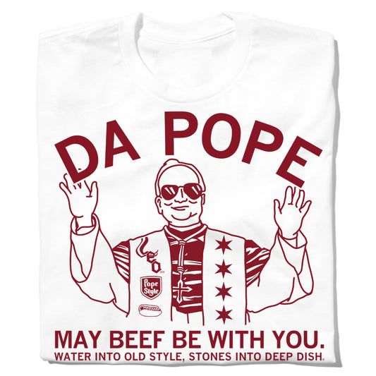 White union-made t-shirt featuring a red line-art illustration of a person wearing sunglasses and a star-covered vest, with the text DA POPE, MAY BEEF BE WITH YOU, and WATER INTO OLD STYLE, STONES INTO DEEP DISH.