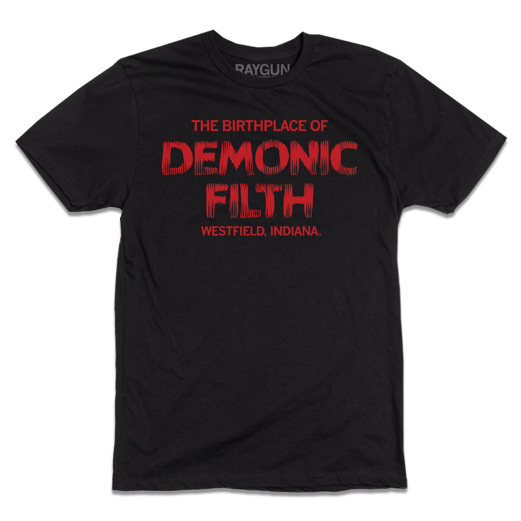 A black t-shirt with bright red ink in centered horror movie font that reads "The birthplace of demonic filth Westfield, Indiana."