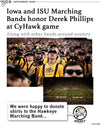 The Iowa marching band wears Derek memorial shirts at a football game to honor Derek Phillips, with an inset photo of the band forming his name on the field.
