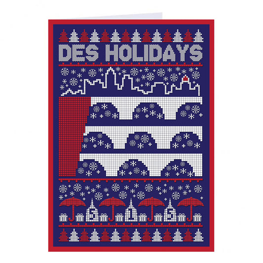 A RAYGUN holiday card with a knit-pattern design depicting a three-tiered Roman aqueduct, the text DES HOLIDAYS, red umbrellas, and gift boxes.