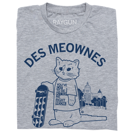 Heather gray t-shirt featuring an illustration of a cat holding a skateboard in front of a capitol building, with the text DES MEOWNES and the cat’s shirt reading YOUVE CAT TO BE KITTEN ME RIGHT MEOW.