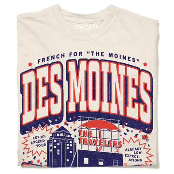 Off-white heavyweight cotton t-shirt with a graphic that reads The Moines Des Moines, featuring an illustration of the Travelers Insurance building and the text Let us exceed your already low expectations on this Des Moines t-shirt.
