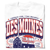White RAYGUN t-shirt with a graphic that reads The Moines Des Moines above an illustration of the Des Moines skyline and the Travelers building with the text Let us exceed your already low expectations.