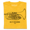 A folded heather yellow t-shirt with a black print illustration of a mellophone and black text below that says, "DO IT FOR DEREK #DIFD"
