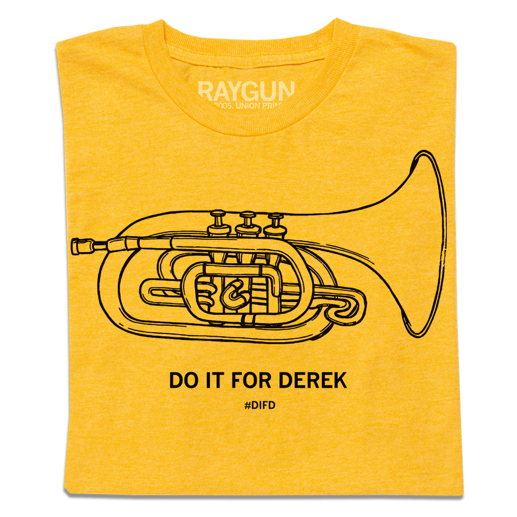 A folded heather yellow t-shirt with a black print illustration of a mellophone and black text below that says, "DO IT FOR DEREK #DIFD"