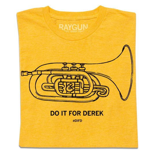 A folded heather yellow t-shirt with a black print illustration of a mellophone and black text below that says, "DO IT FOR DEREK #DIFD"