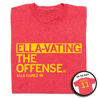 A folded heather red t-shirt with left aligned yellow print text that reads "ELLA-VATING THE OFFENSE" with smaller print below that says, "ELLA FLOREZ" with a tiny outline of Iowa to the right that has "11" in it. A circular picture in the bottom right shows the back of the shirt. The back is printed like a jersey with "FLOREZ" at the top above a large "11."