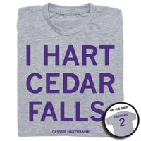 Folded heather grey shirt with purple ink that reads "I Hart Cedar Falls" above "Cassidy Hartman" and on the back "Hartman 2"