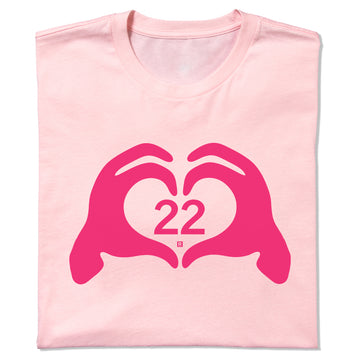 Neon pink RAYGUN T-shirt featuring a dark pink graphic of hands forming a heart shape around the number 22.