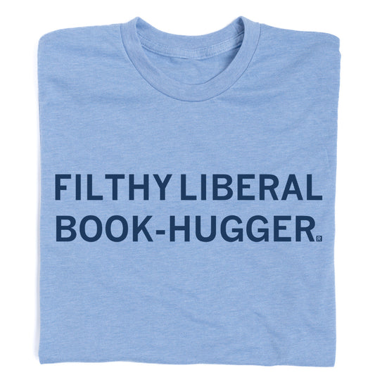 Light blue RAYGUN t-shirt featuring the text FILTHY LIBERAL BOOK-HUGGER printed in dark blue.
