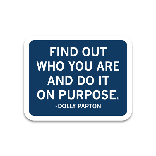 A rectangular blue sticker with rounded edges, a white border, and white text that says, "Find out who you are and do it on purpose." - Dolly Parton"