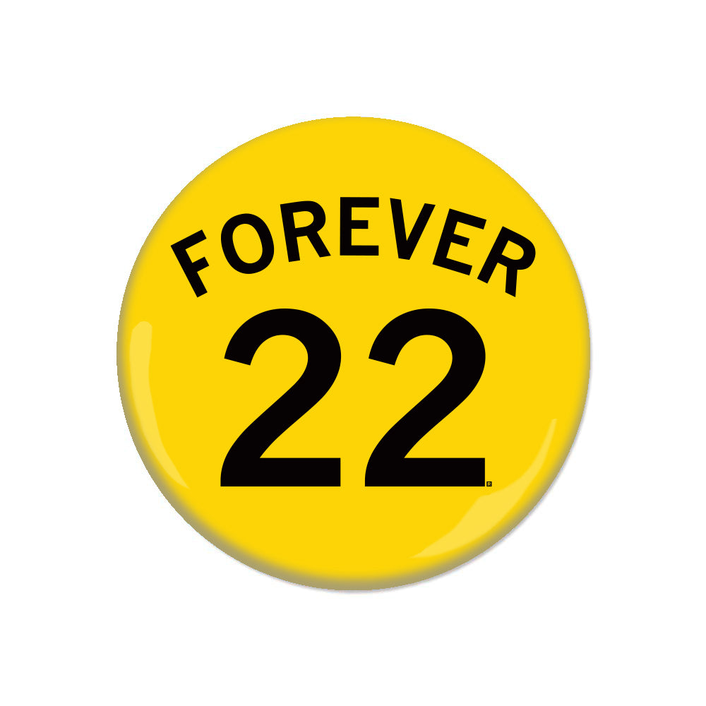 Yellow RAYGUN metal pin-back button with the text FOREVER arched over the number 22 in black.