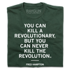 Forest green T-shirt printed with the white text YOU CAN KILL A REVOLUTIONARY, BUT YOU CAN NEVER KILL THE REVOLUTION and FRED HAMPTON on the chest. This Made in USA garment is constructed with union labor.