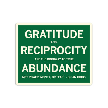 Green rectangular gratitude sticker with white text that reads, Gratitude and reciprocity are the doorway to true abundance, not power, money, or fear. - Brian Gibbs.