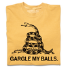A folded heavyweight yellow t-shirt with black ink print spoofing the don't tread on me flag with "GARGLE MY BALLS" printed below the snake.