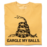 A folded heavyweight yellow t-shirt with black ink print spoofing the don't tread on me flag with "GARGLE MY BALLS" printed below the snake.