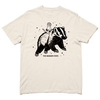 Ivory Comfort Colors heavyweight t-shirt with a black ink graphic of a cat wearing a cheese hat riding a giant badger above the text "The Badger State"